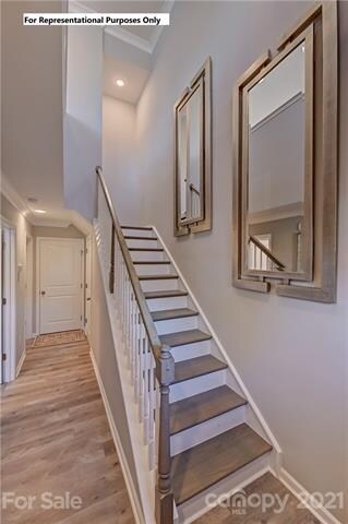 Front door entrance boasts a beautiful two-story f