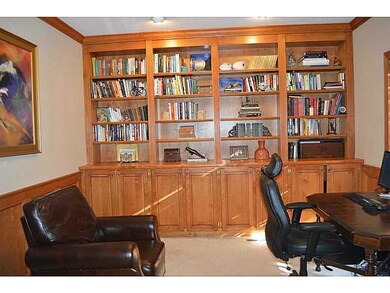 Den. Custom woodwork in den! Built-in cabinetry an