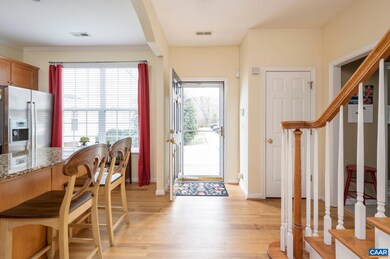 Enter the light-filled foyer via the covered front