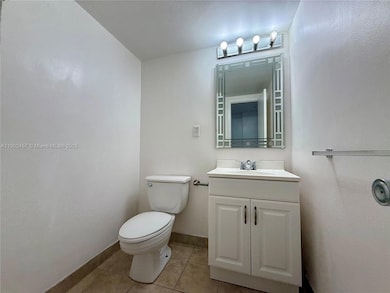 Half bathroom by entrance