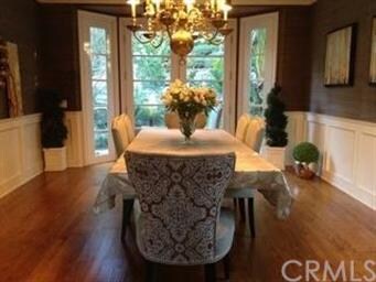 Elegant, formal dining room with hardwood floors a