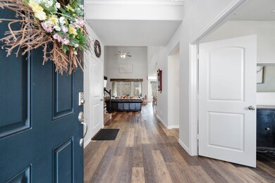 Stepping inside you find a bright entrance showcasing custom paint, beautiful wood-like floors, clean edges with high ceilings, open views and a balcony!