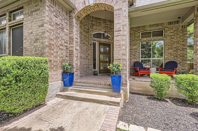 Entrance to property featuring covered porch and 