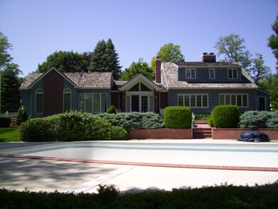 pool and back view of home