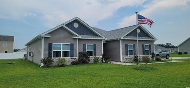 Side view of house with a lawn