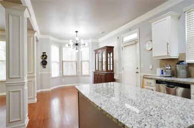 Kitchen featuring crown molding, an inviting chand