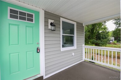 Property entrance with covered porch