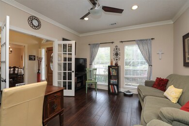 The office sits upfront and boast hardwood flooring, crown molding and recessed lighting.