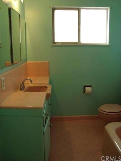 Bathroom with all original pink tile and fixtures