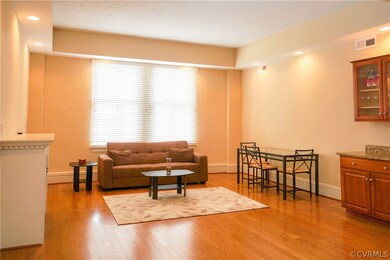 Living area offers attractive built-in cabinets, w
