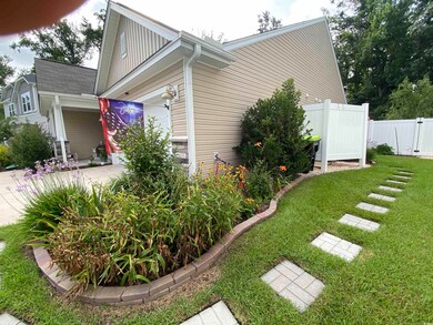 View of side of property with a lawn