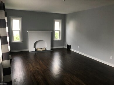 Freshly Stained Hardwood Throughout