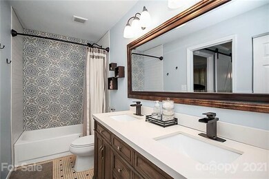 New tile surround for bathtub