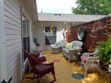 Nice patio with brick wall and new vinyl privacy g
