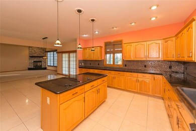 Another kitchen view with island and Jenn Air rang
