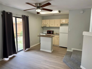 Kitchen with white appliances, under cabinet rang
