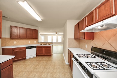 Kitchen offering generous cabinetry and storage to suit your needs.