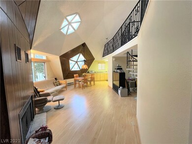 The open floorplan includes a living room, dining