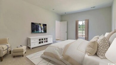 Bedroom featuring light colored carpet