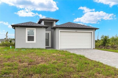 Prairie-style home with an attached garage, stucco