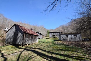 outbuildings on left of driveway with this propert