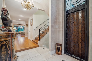 The main entry has a staircase and glass elevator