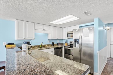 Kitchen featuring stainless steel appliances, whit