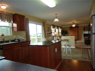 Kitchen. Glass doors by eat-in-kitchen lead to dec