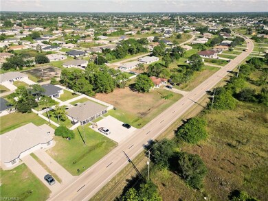 Aerial overview of property's location featuring nearby suburban area