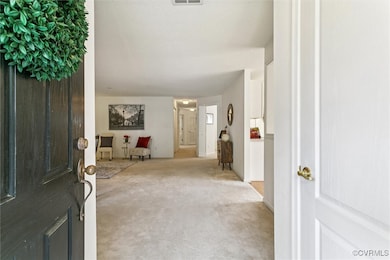 View of carpeted foyer