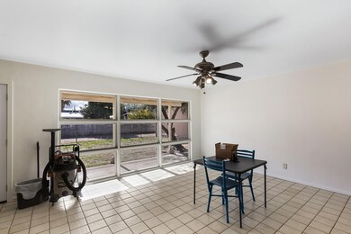 Dining rm w lots of dual pane windows.