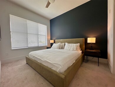 spacious bedroom with large window