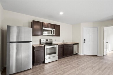 
The kitchen offers ample counter space and a spac