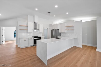 Kitchen with white cabinetry, stainless steel appl