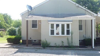 The side entry is a three season sunroom with door