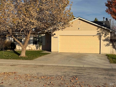 View of front facade with driveway and an attached garage