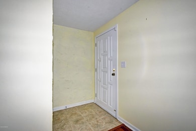 Foyer with a coat closet