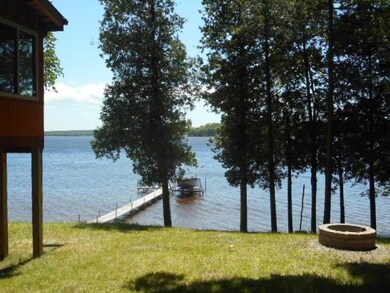 150' on S. Manistique lake with log cabi