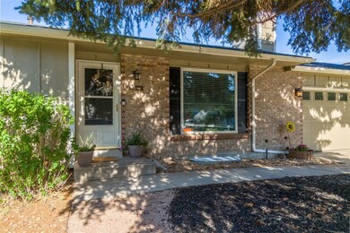 Doorway to property featuring brick siding and an
