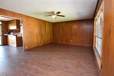 Large family room with new ceiling fan