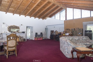 Another view to show the enormity of this room    Notice the how high the ceiling apex is.    Notice how much light the Clerestory windows let into the room.   Yes, he is getting ready to move.