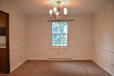 Formal dining room with crown molding.