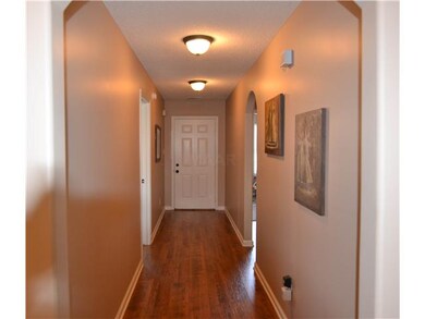 ENTERING THE HOME, NOTICE THE PRETTY HARDWOOD!