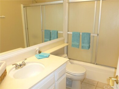 Hall bath - tile floor and glass tub enclosure