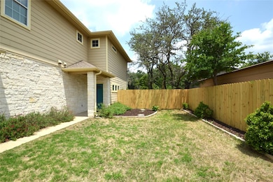 View of yard featuring fence