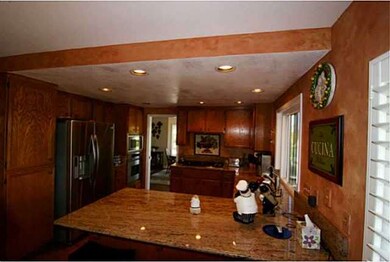 Beautiful custom slab granite countertops. LG refr