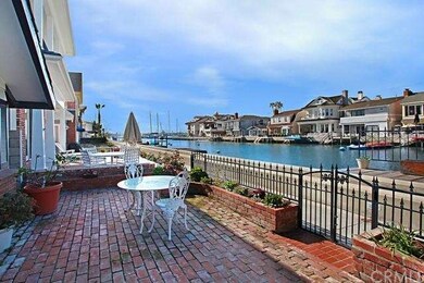 Sunny front patio and high tide pier looking to So