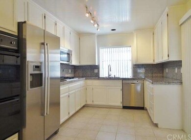 Kitchen with granite counter-tops and stainless st