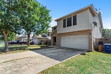 Traditional home with brick siding, an attached g