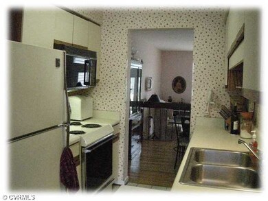 Kitchen - Galley kitchen is open to the front and 